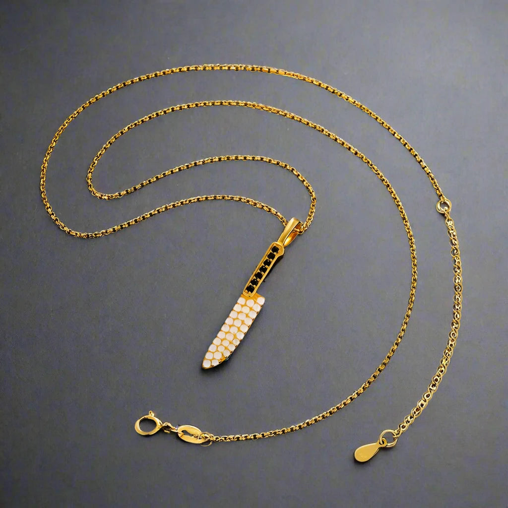 iced out Gold Knife pendant