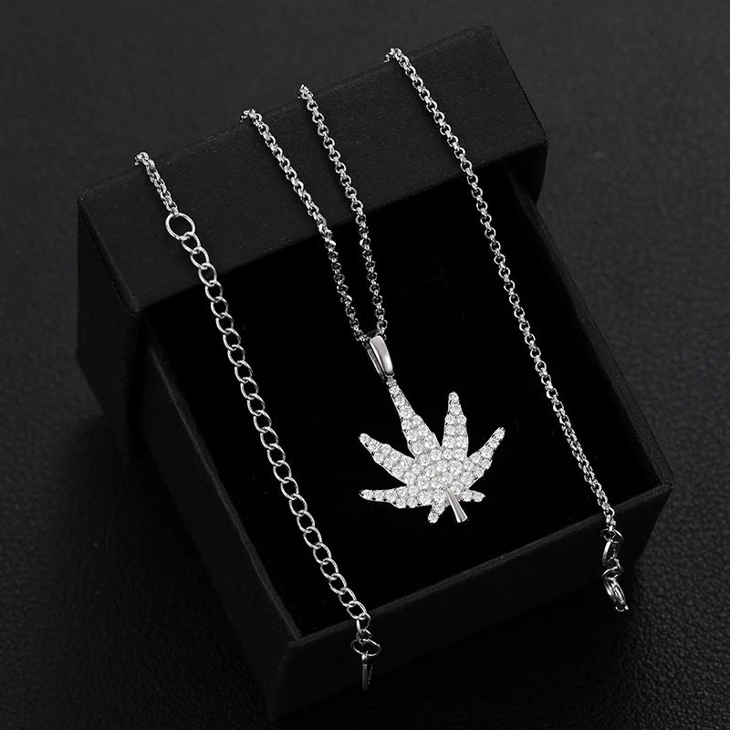 iced out white gold marijuana pendant