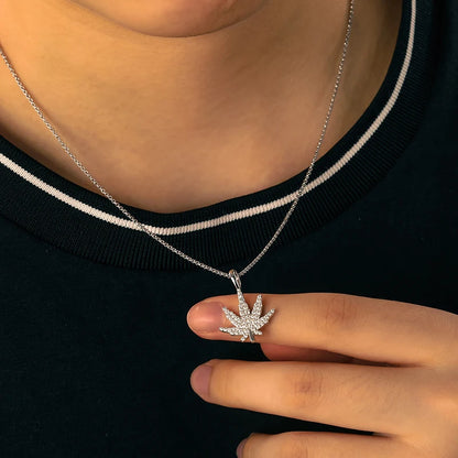 iced out white gold marijuana pendant